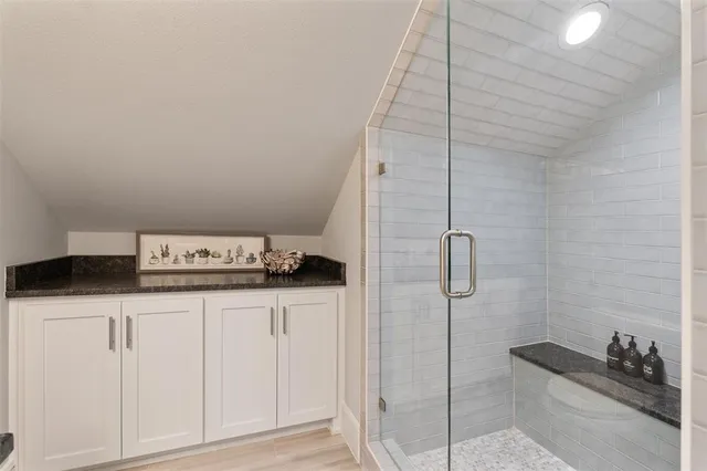 a kitchen with a sink and cabinets