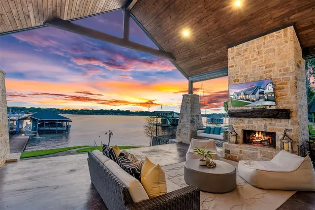 a view of a terrace with furniture and a fireplace