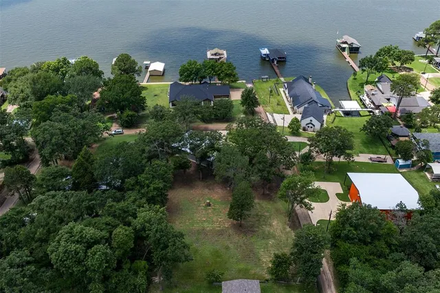an aerial view of house with yard swimming pool and outdoor seating