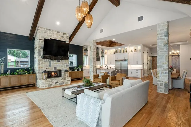 a living room with fireplace furniture and a flat screen tv