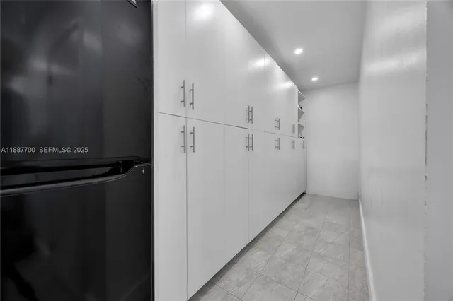 a kitchen with stainless steel appliances granite countertop a stove and a refrigerator