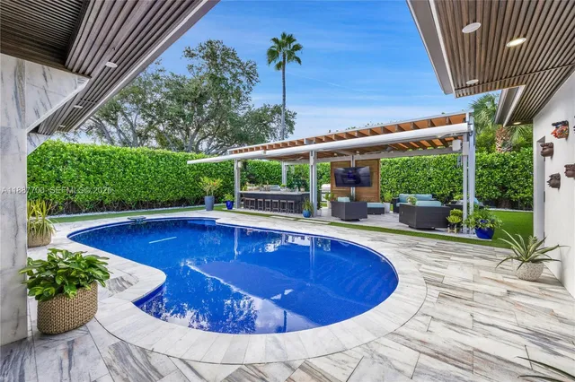 a view of swimming pool with seating space