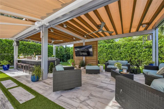 a kitchen with a sink a counter top space and wooden floor