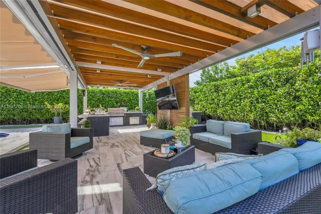 a view of a garden with furniture