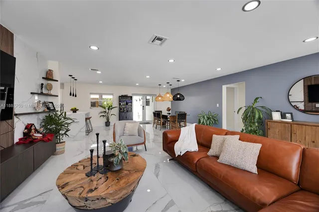 a living room with furniture and a table