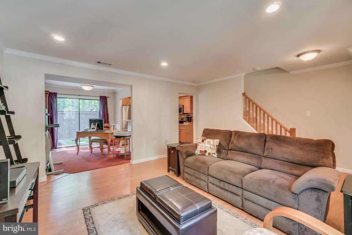 2444 Cloudcroft Square Reston, VA 20191 - Photo 6 of 32 Living Room Opens to Dining Area and Kitchen