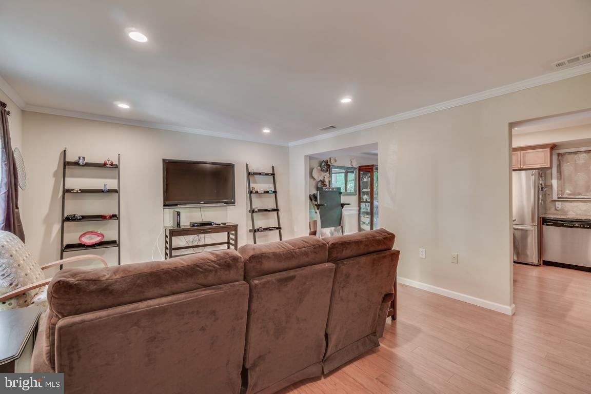 2444 Cloudcroft Square Reston, VA 20191 - Photo 7 of 32 Living Room Opens to Dining Area and Kitchen