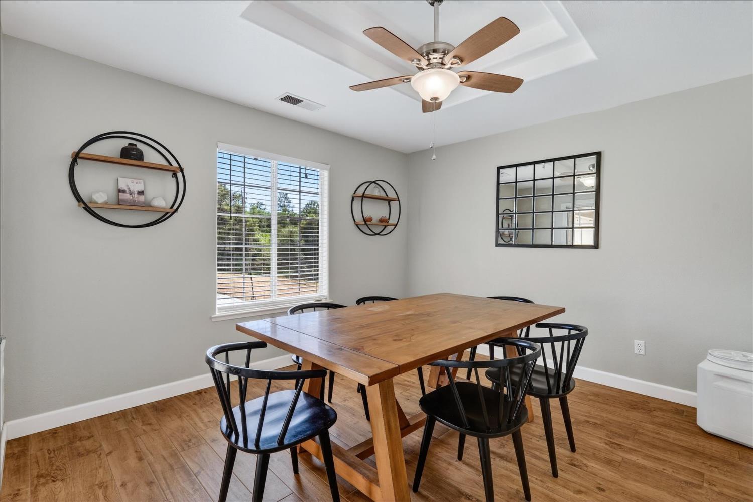 47482 Veater Ranch Road Coarsegold, CA 93614 - Photo 16 of 51 a view of a dining room with furniture window and wooden floor