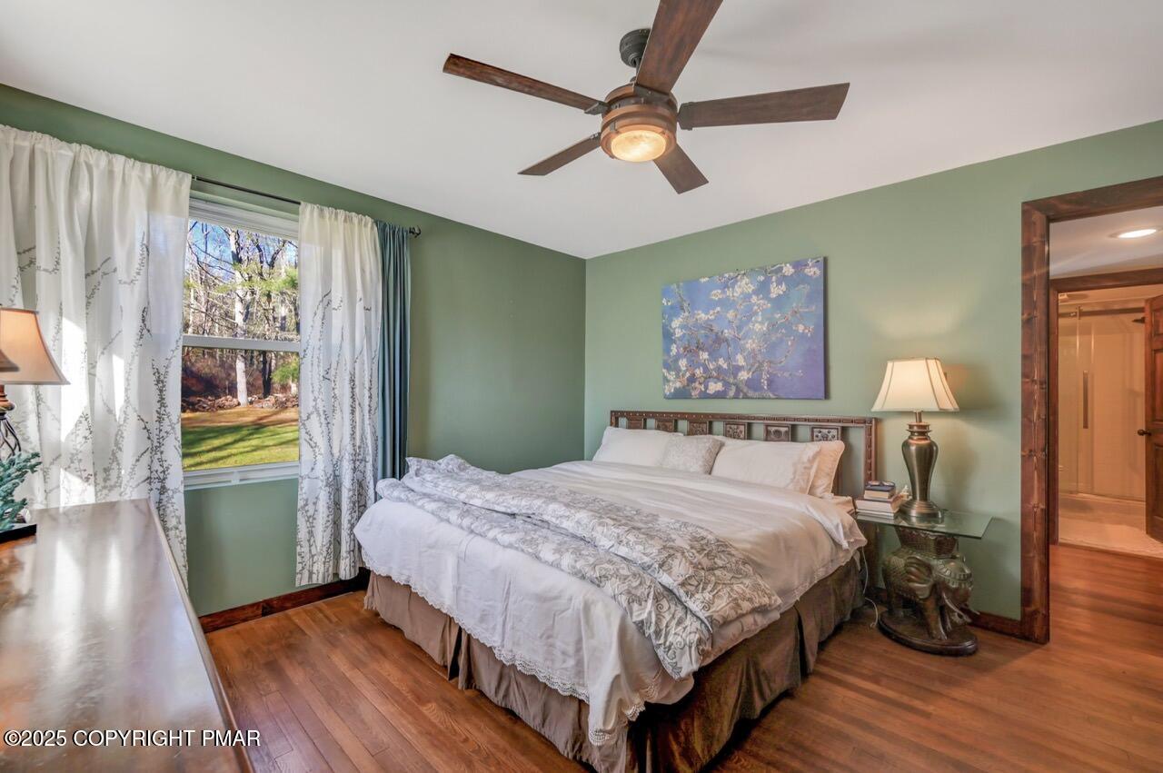 3 Stone Tree Drive Canadensis, PA 18325 - Photo 158 of 201 a bedroom with a bed wooden floor and window