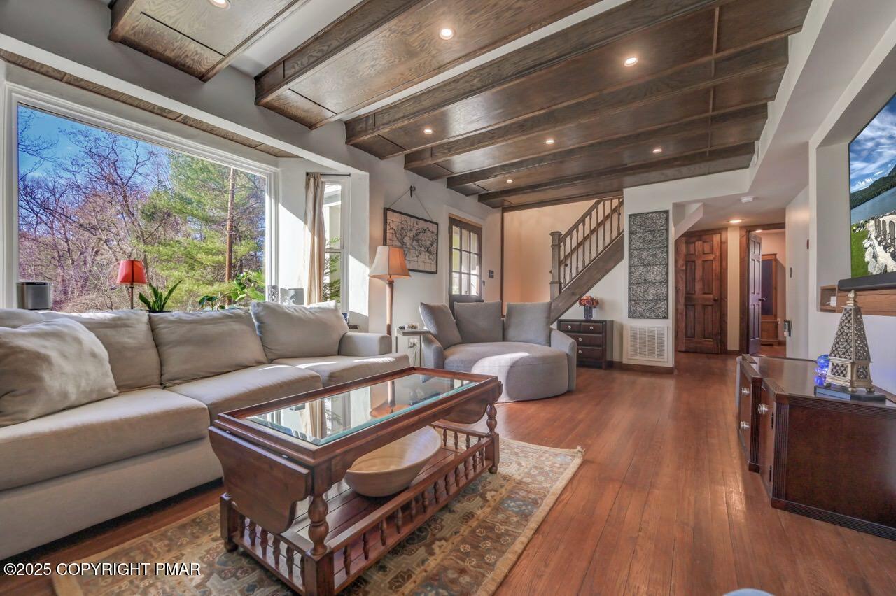 3 Stone Tree Drive Canadensis, PA 18325 - Photo 17 of 201 a living room with furniture a wooden floor and a large window
