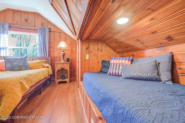 a view of walk in closet with clothes