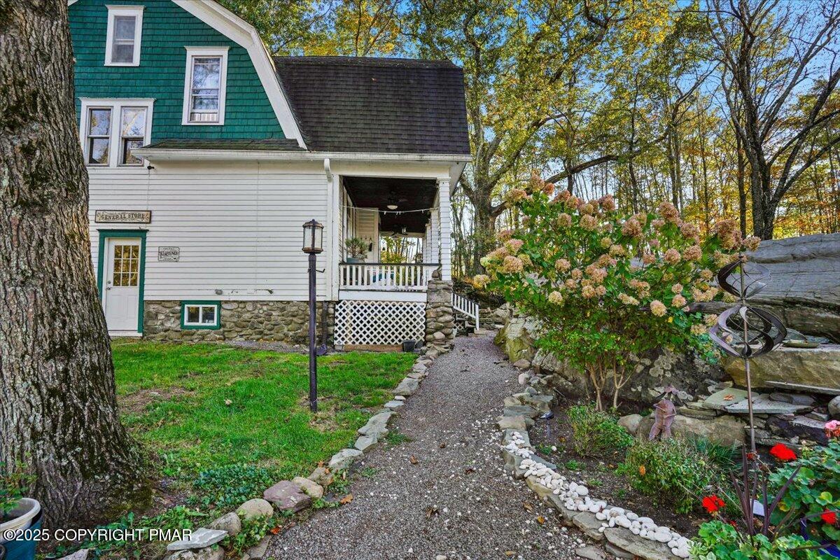 3 Stone Tree Drive Canadensis, PA 18325 - Photo 38 of 201 a front view of a house with a garden and trees