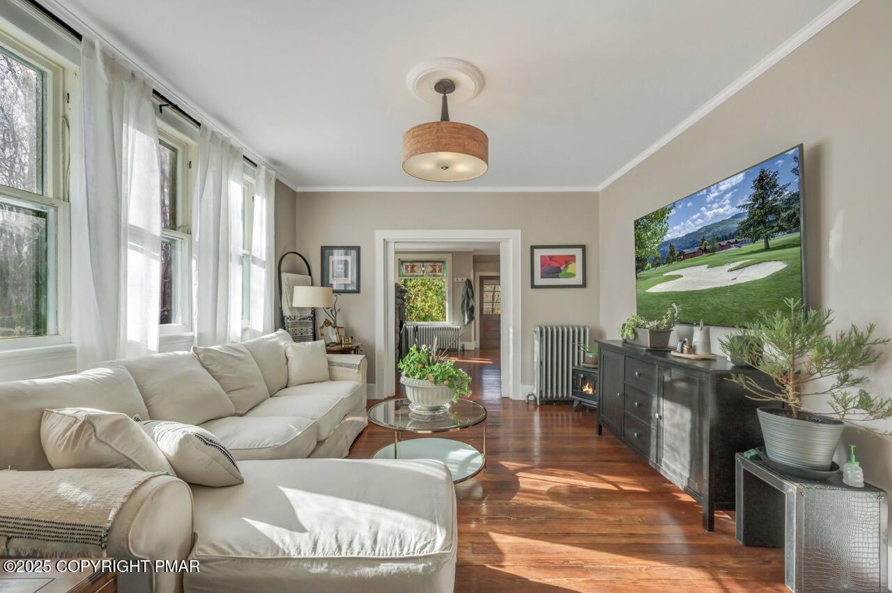 3 Stone Tree Drive Canadensis, PA 18325 - Photo 4 of 201 a living room with furniture a flat screen tv and a large window