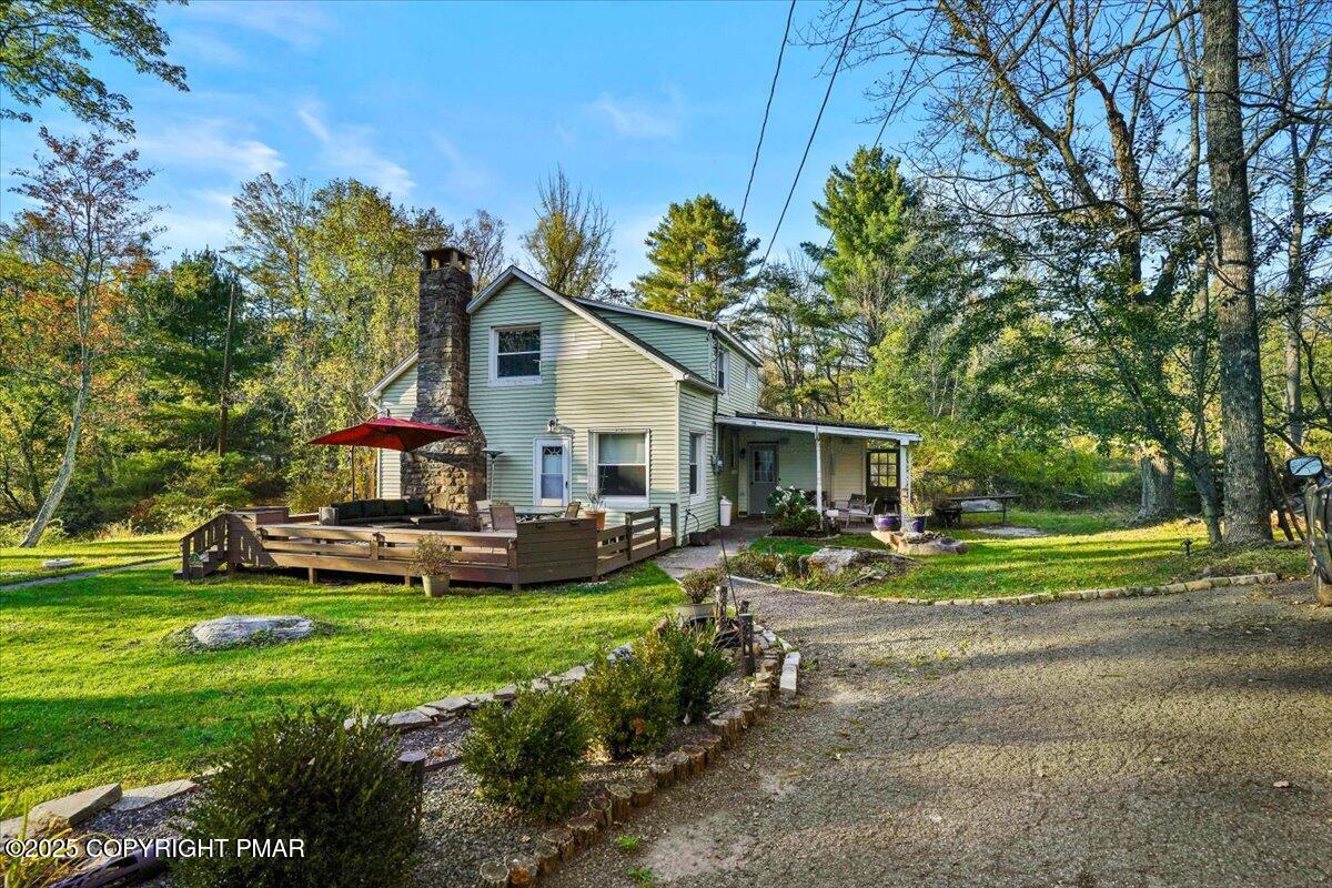 3 Stone Tree Drive Canadensis, PA 18325 - Photo 46 of 201 a front view of a house with a yard table and chairs