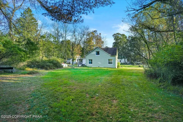 a view of a backyard of the house