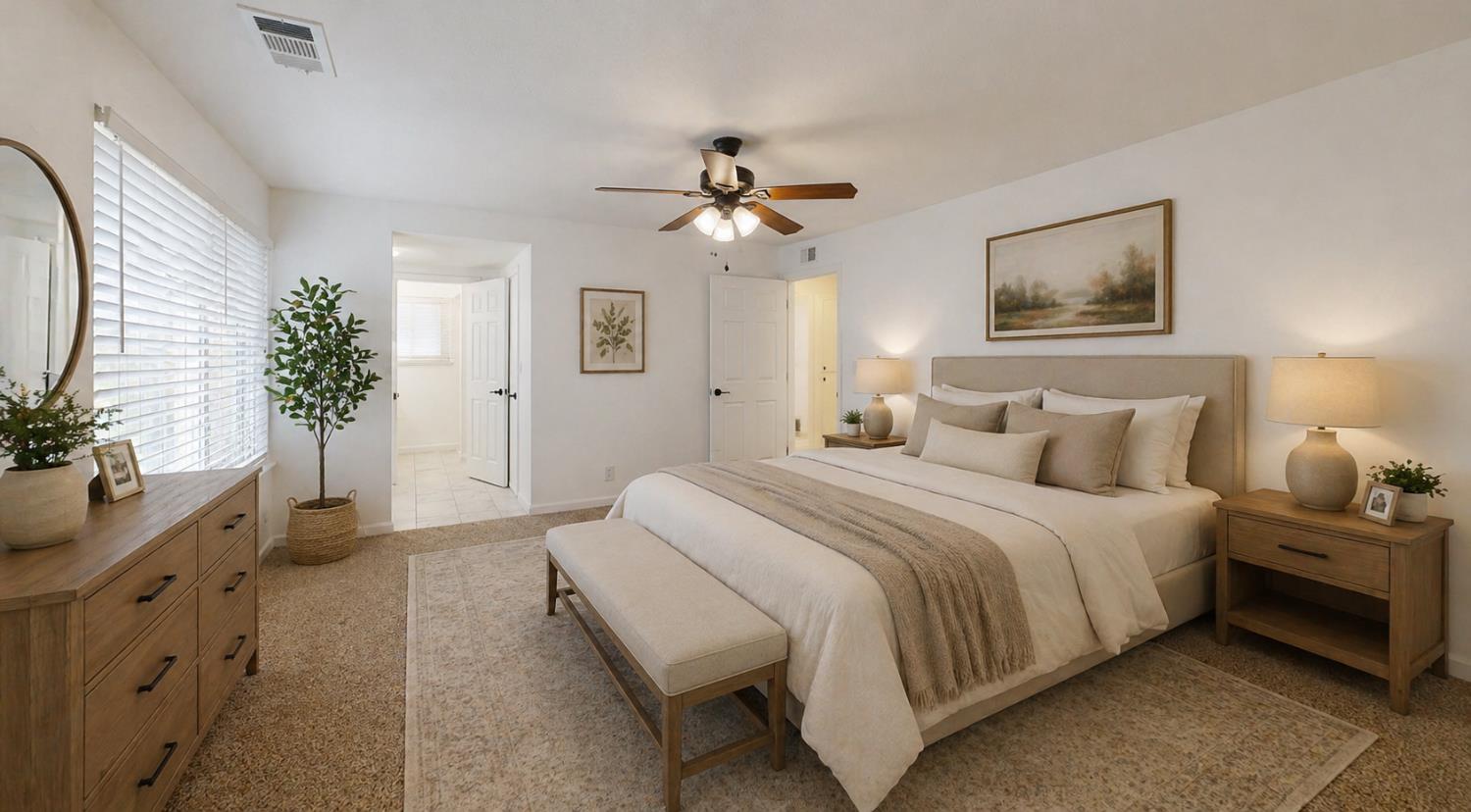 3279 Cherokee Avenue Merced, CA 95340 - Photo 13 of 30 a spacious bedroom with a bed and a potted plant