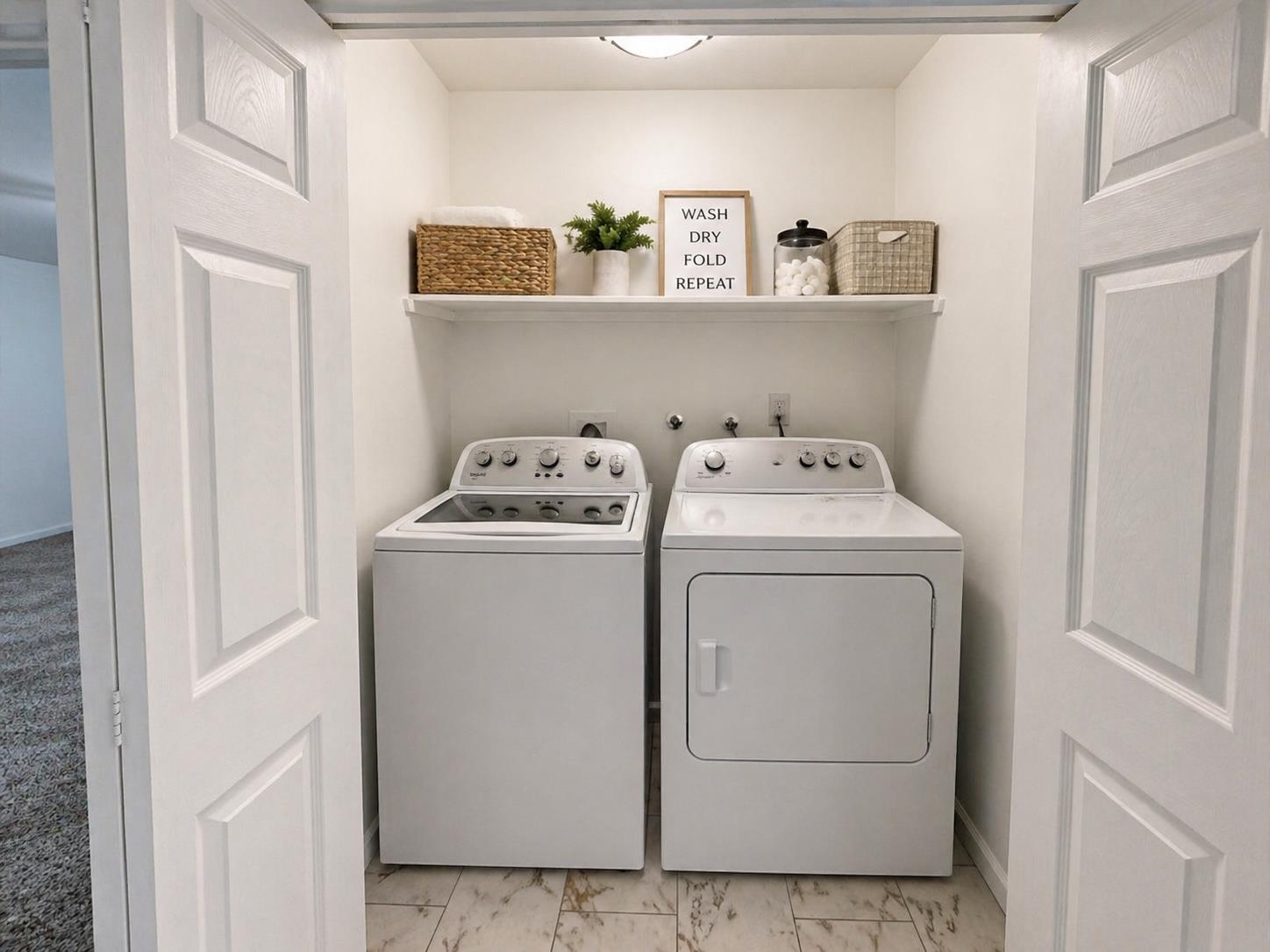 3279 Cherokee Avenue Merced, CA 95340 - Photo 21 of 30 a utility room with dryer washer and empty racks