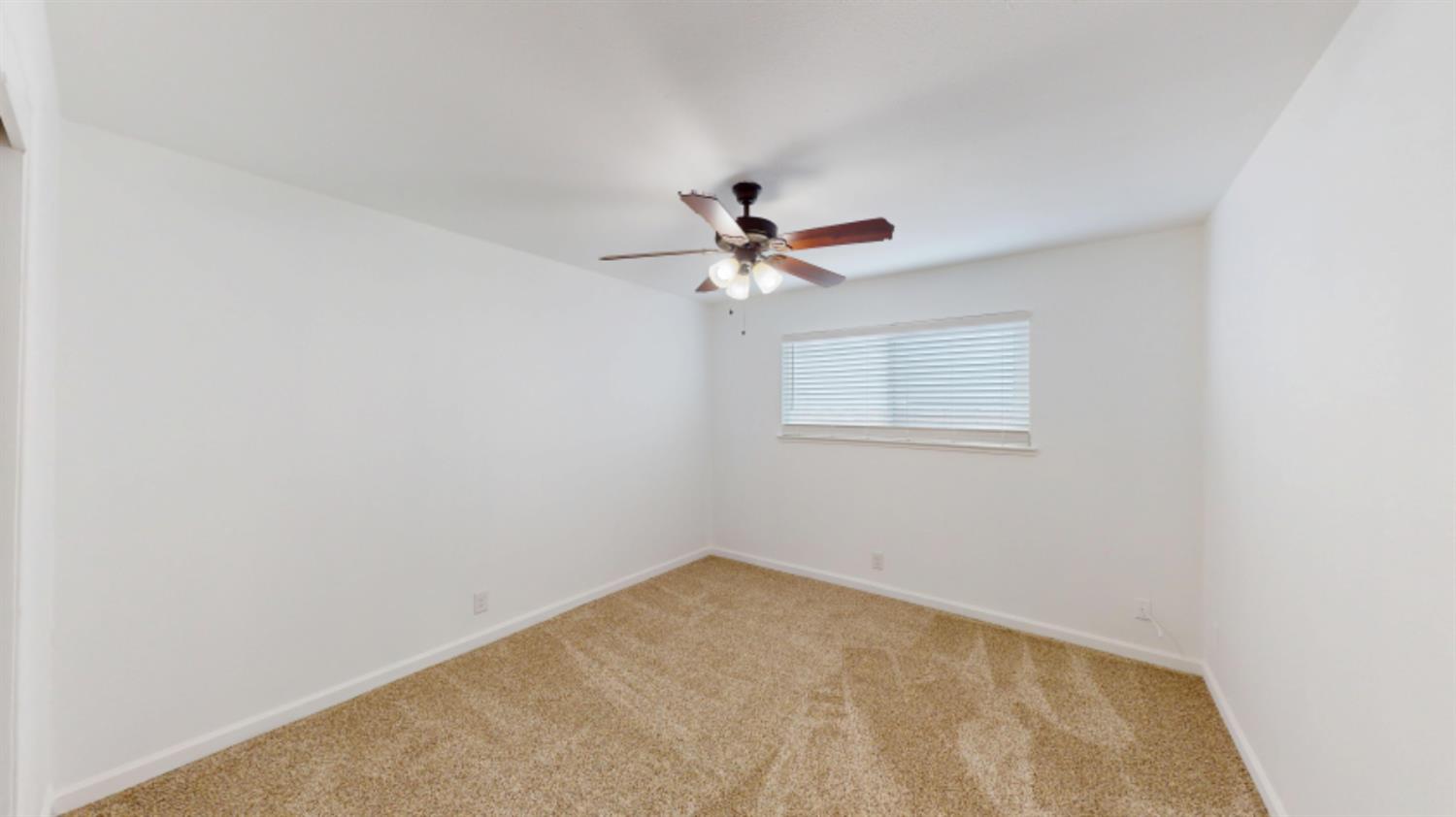 3279 Cherokee Avenue Merced, CA 95340 - Photo 27 of 30 a view of a room with a ceiling fan