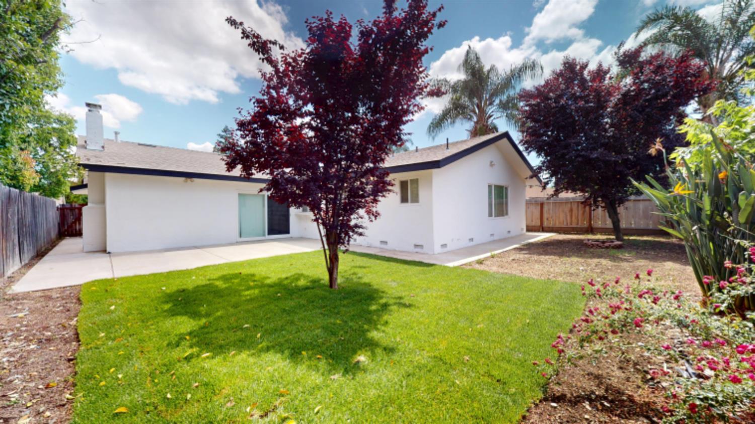 3279 Cherokee Avenue Merced, CA 95340 - Photo 29 of 30 a house with garden in front of it