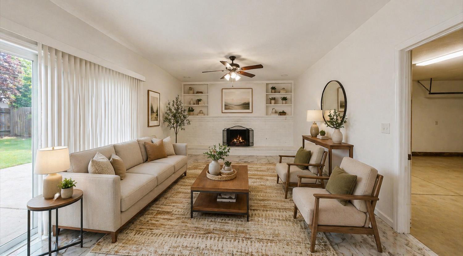 3279 Cherokee Avenue Merced, CA 95340 - Photo 6 of 30 a living room with furniture a fireplace and a flat screen tv