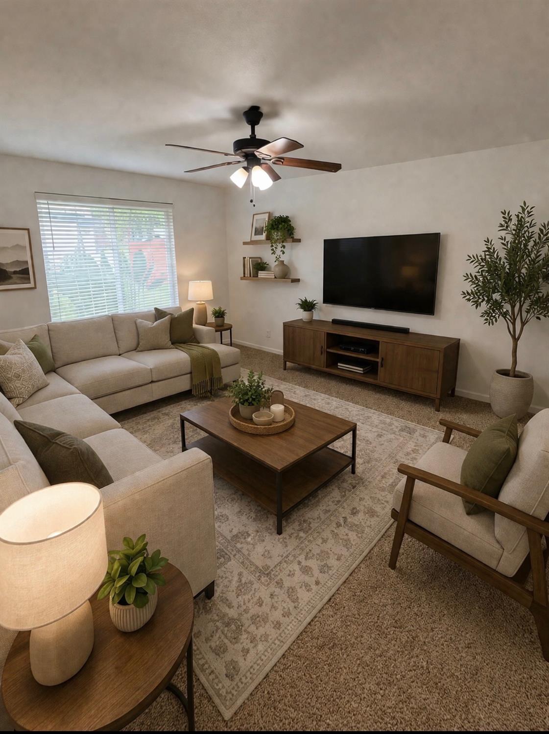 3279 Cherokee Avenue Merced, CA 95340 - Photo 8 of 30 a living room with furniture a flat screen tv and a window