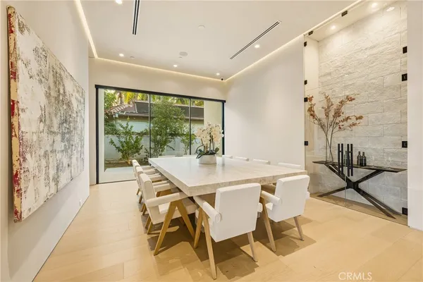 a very nice looking dining room with a table and chairs