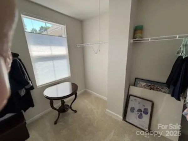 a bathroom with a toilet and a mirror