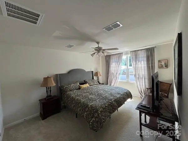 a bed room with a bed and a window