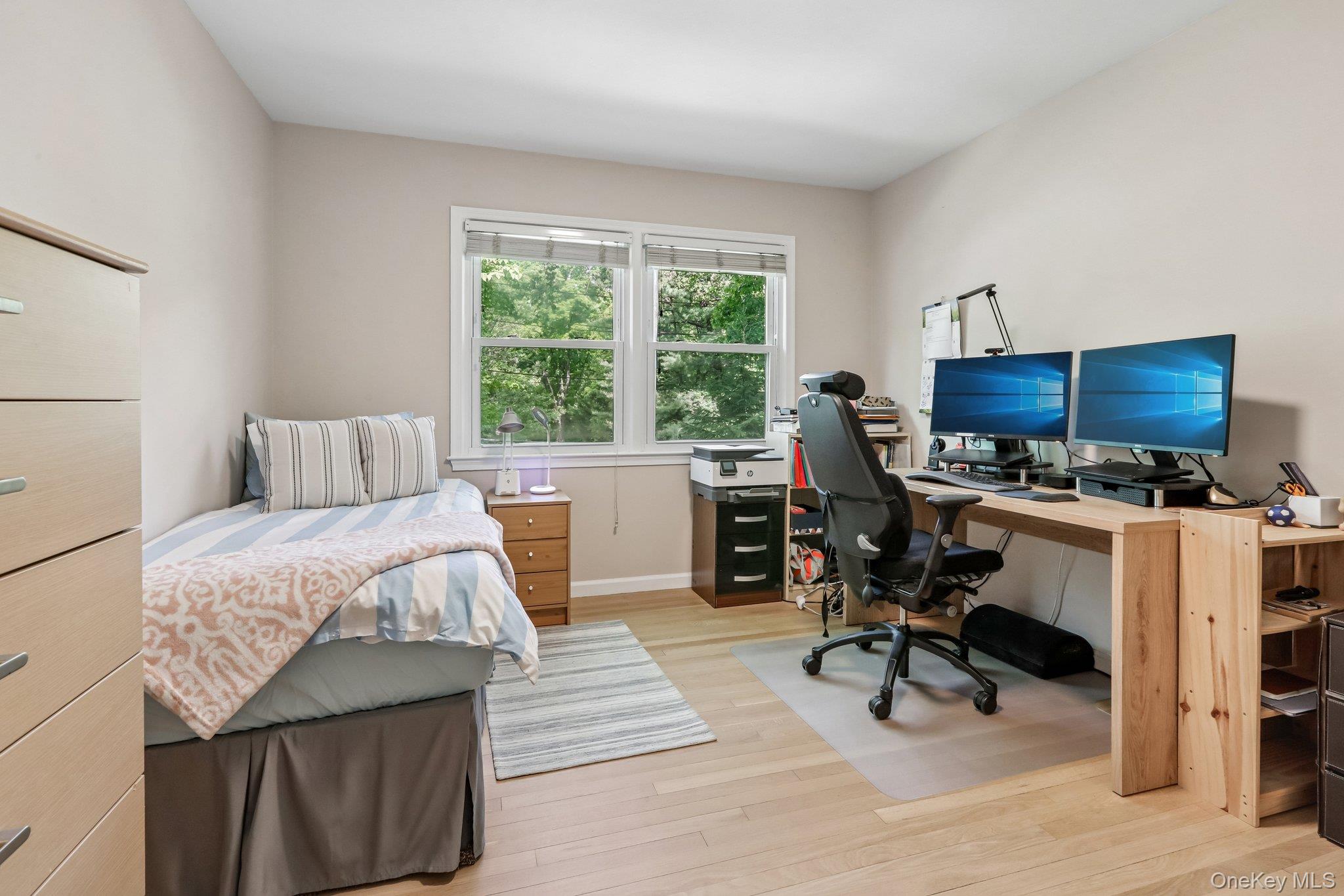 62 Mohegan Road Larchmont, NY 10538 - Photo 36 of 46 a bedroom with furniture and a window