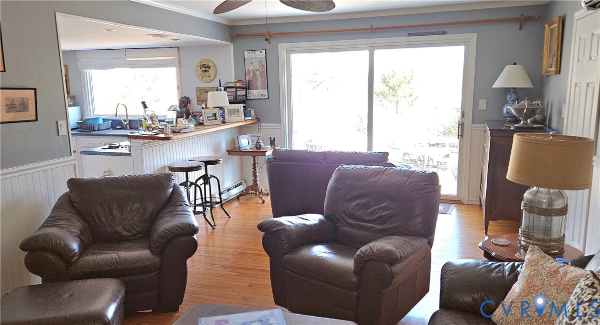 459 Willow Lane Topping, VA 23169 - Photo 13 of 47 a living room with furniture and a large window