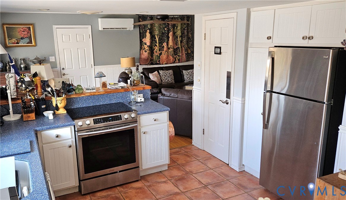 459 Willow Lane Topping, VA 23169 - Photo 17 of 47 a kitchen with white cabinets and white appliances