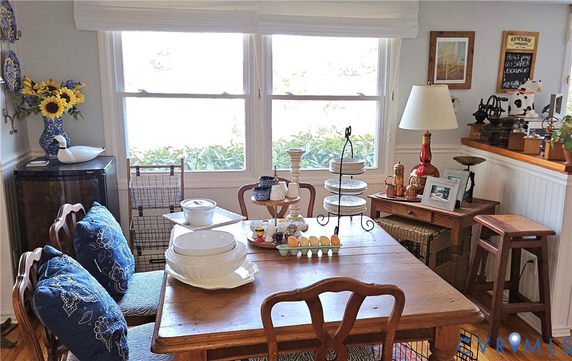 459 Willow Lane Topping, VA 23169 - Photo 18 of 47 a dining room with furniture a large window and a chandelier