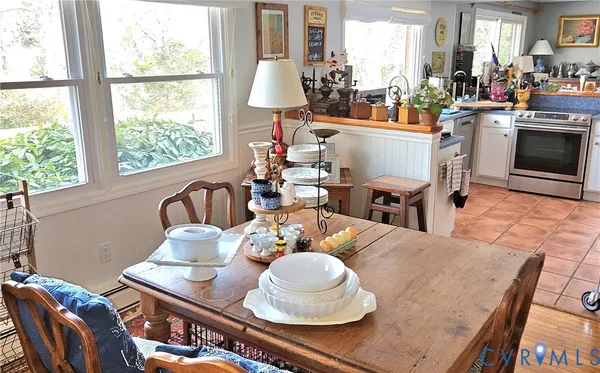 a view of a dining room with furniture window and outside view