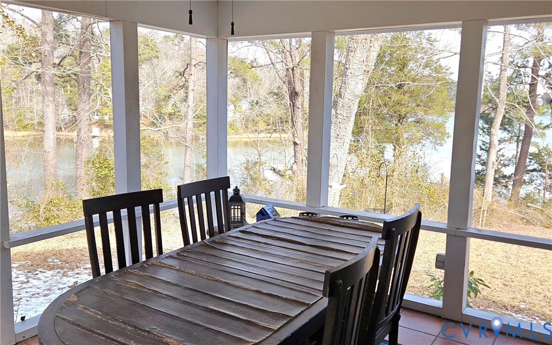 459 Willow Lane Topping, VA 23169 - Photo 24 of 47 a view of a dining room with furniture window and wooden floor