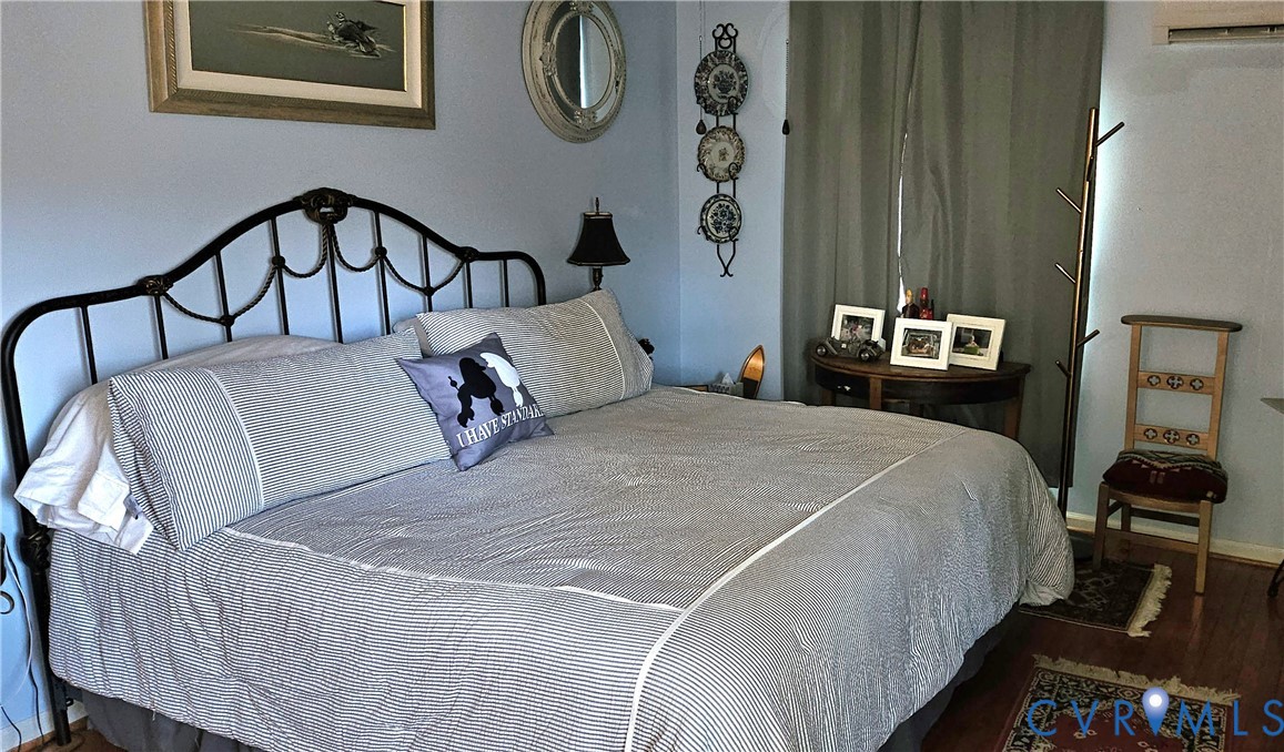 459 Willow Lane Topping, VA 23169 - Photo 26 of 47 a bedroom with a bed and painting on the wall