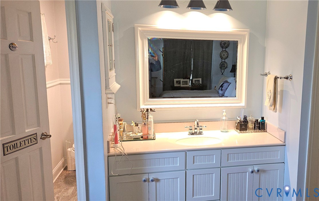 459 Willow Lane Topping, VA 23169 - Photo 28 of 47 a bathroom with a sink and a mirror