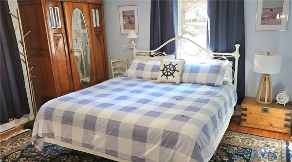 a view of a hallway view with wooden floor and staircase