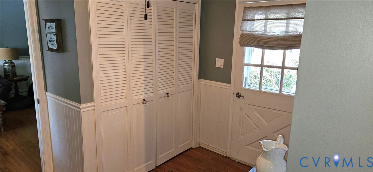 459 Willow Lane Topping, VA 23169 - Photo 35 of 47 a view of entryway with wooden floor and cabinet