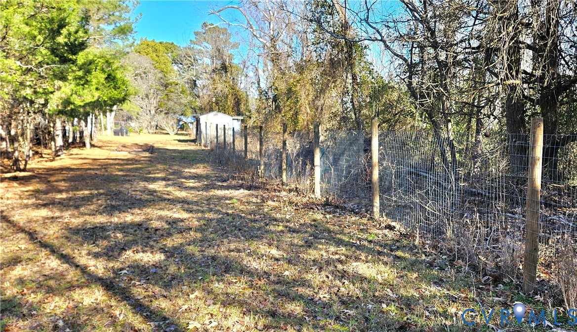 459 Willow Lane Topping, VA 23169 - Photo 46 of 47 a view of a yard with plants and trees