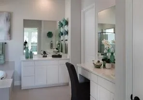 a dining room with furniture and potted plant