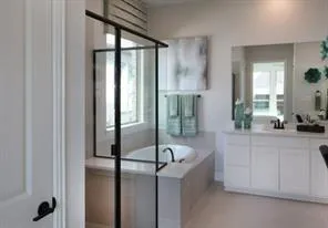 a bathroom with a bathtub and a sink