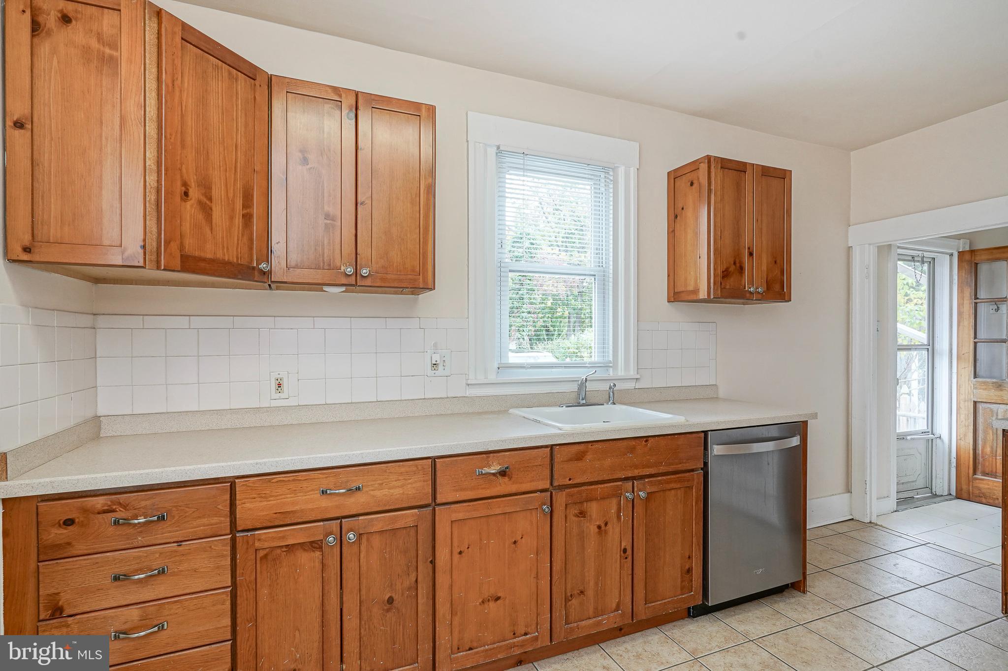 107 Colonial Avenue Haddonfield, NJ 08033 - Photo 11 of 29 a kitchen with stainless steel appliances granite countertop a sink and cabinets