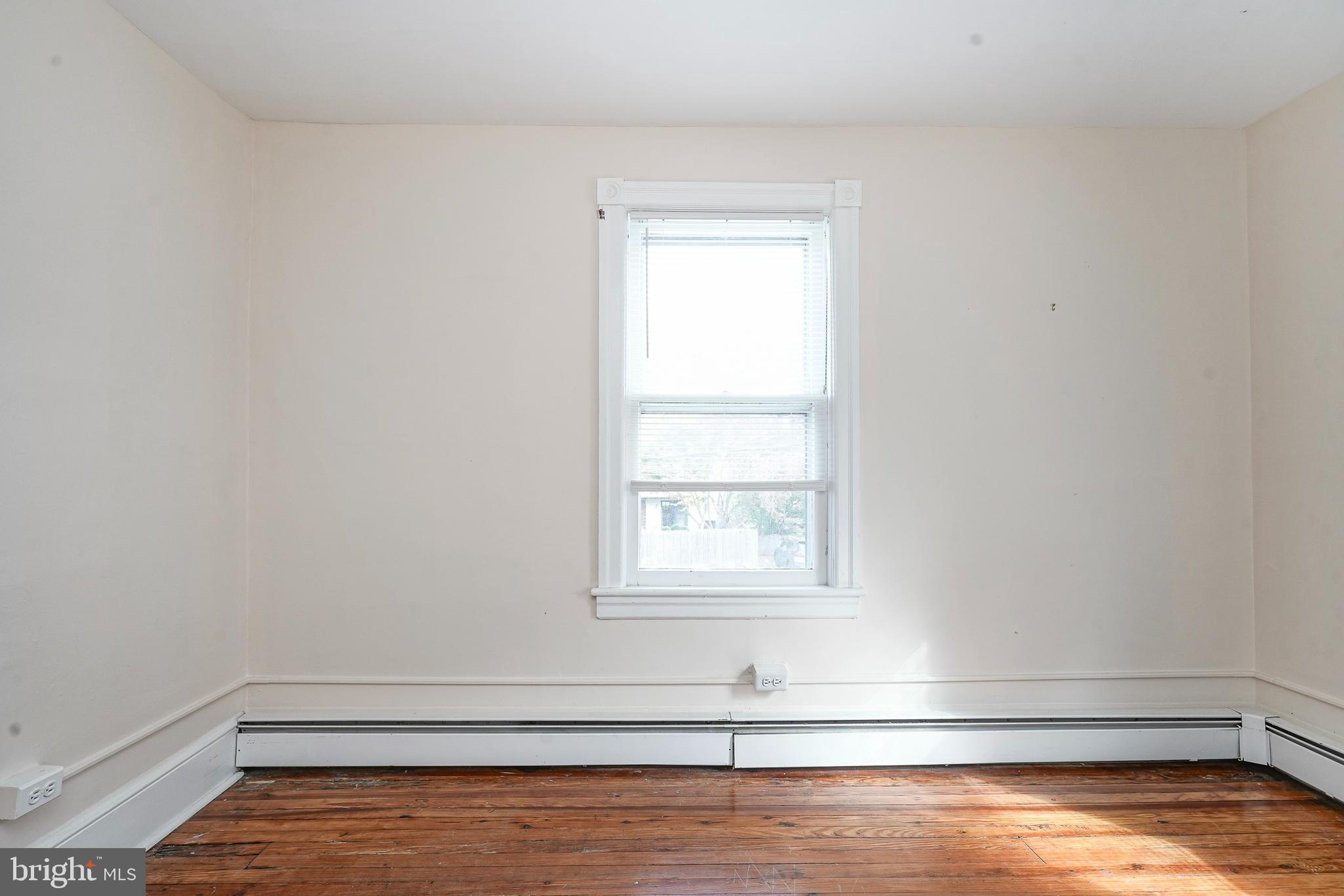 107 Colonial Avenue Haddonfield, NJ 08033 - Photo 19 of 29 a view of a room with wooden floor and window