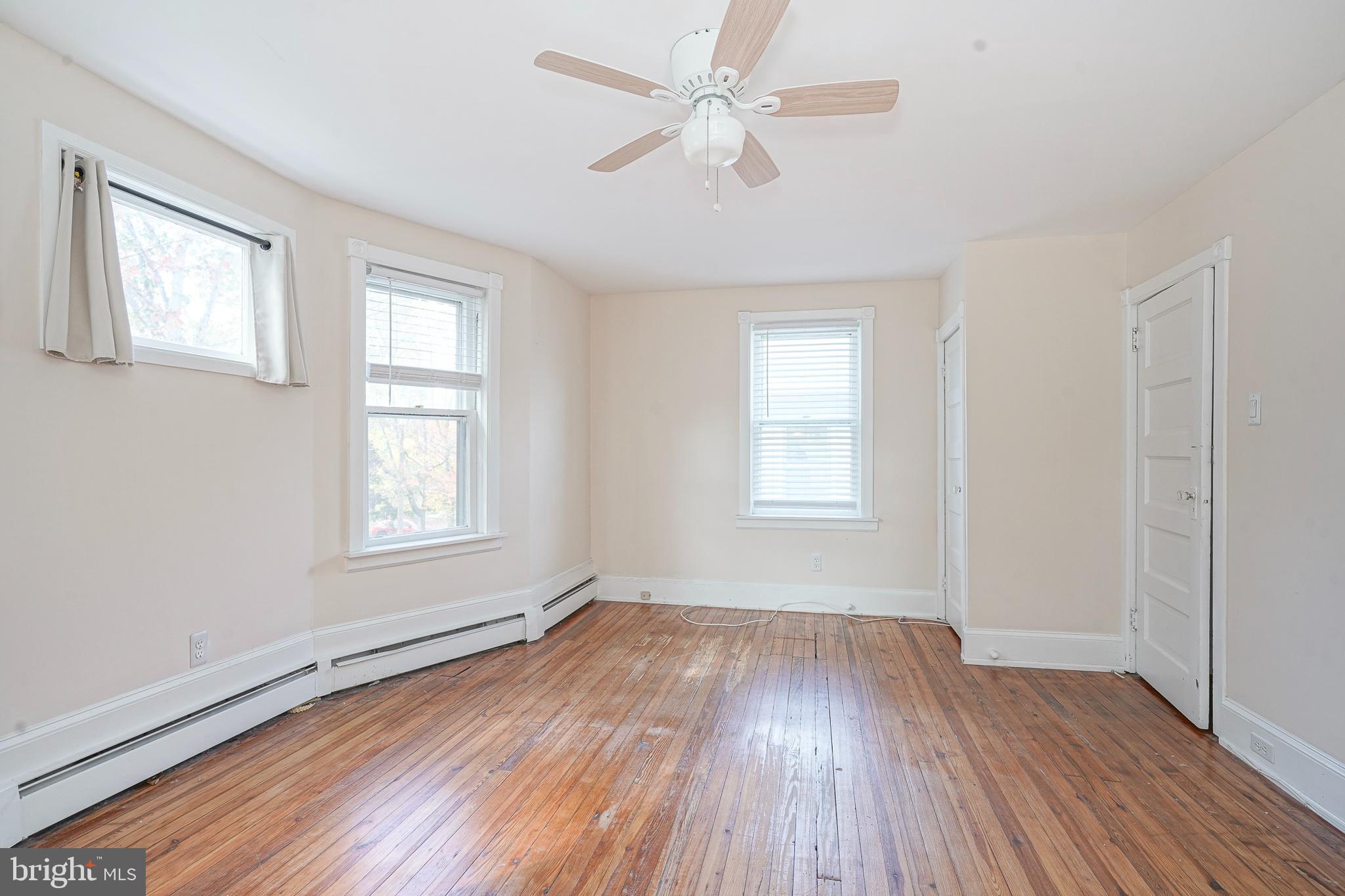 107 Colonial Avenue Haddonfield, NJ 08033 - Photo 24 of 29 a view of an empty room with wooden floor and a window