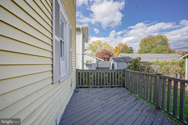 a view of a balcony with wooden floor
