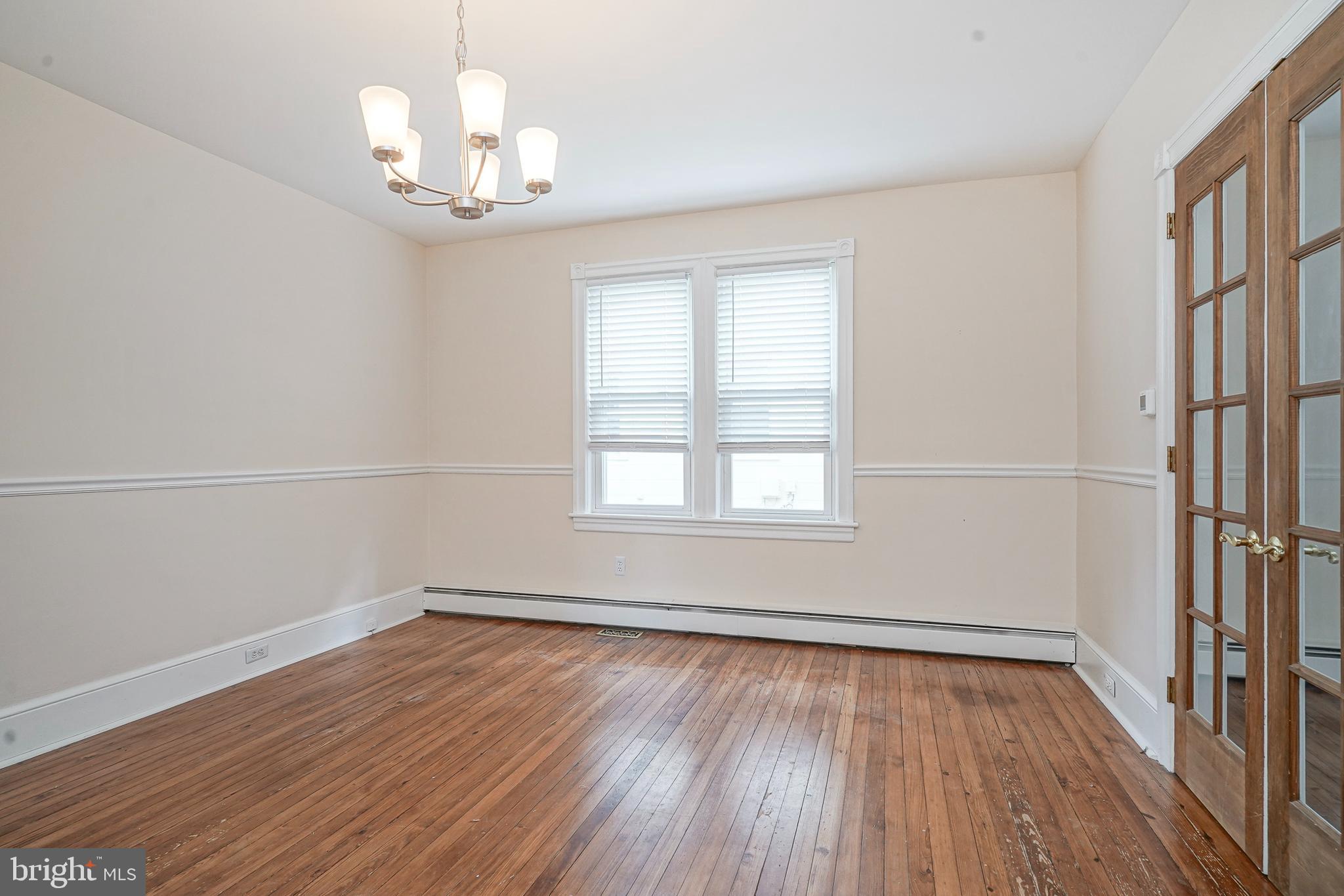 107 Colonial Avenue Haddonfield, NJ 08033 - Photo 7 of 29 wooden floor in an empty room with a window