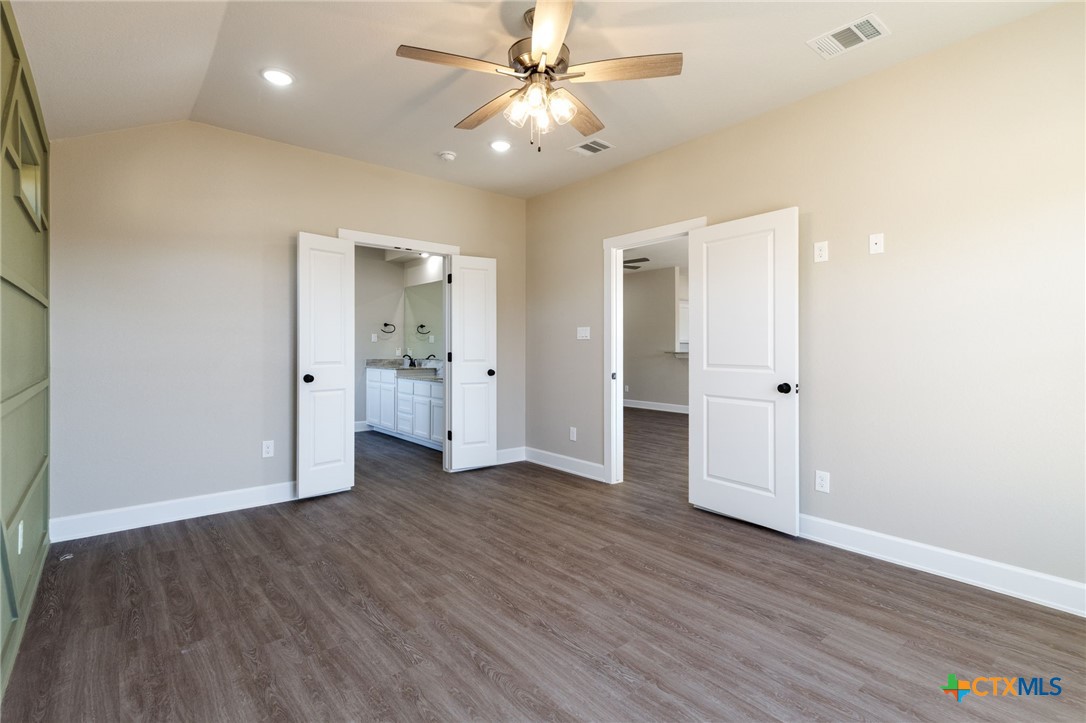 2005 Blackhawk Loop Belton, TX 76513 - Photo 16 of 37 wooden floor in an empty room with a window