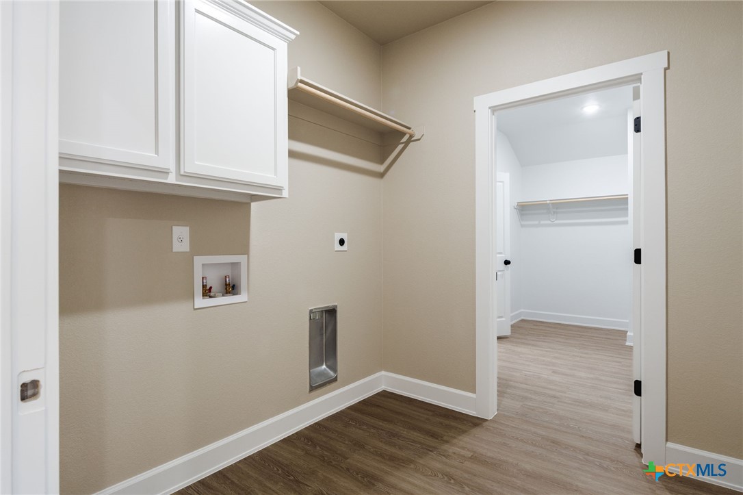 2005 Blackhawk Loop Belton, TX 76513 - Photo 26 of 37 a view of an empty room with wooden floor