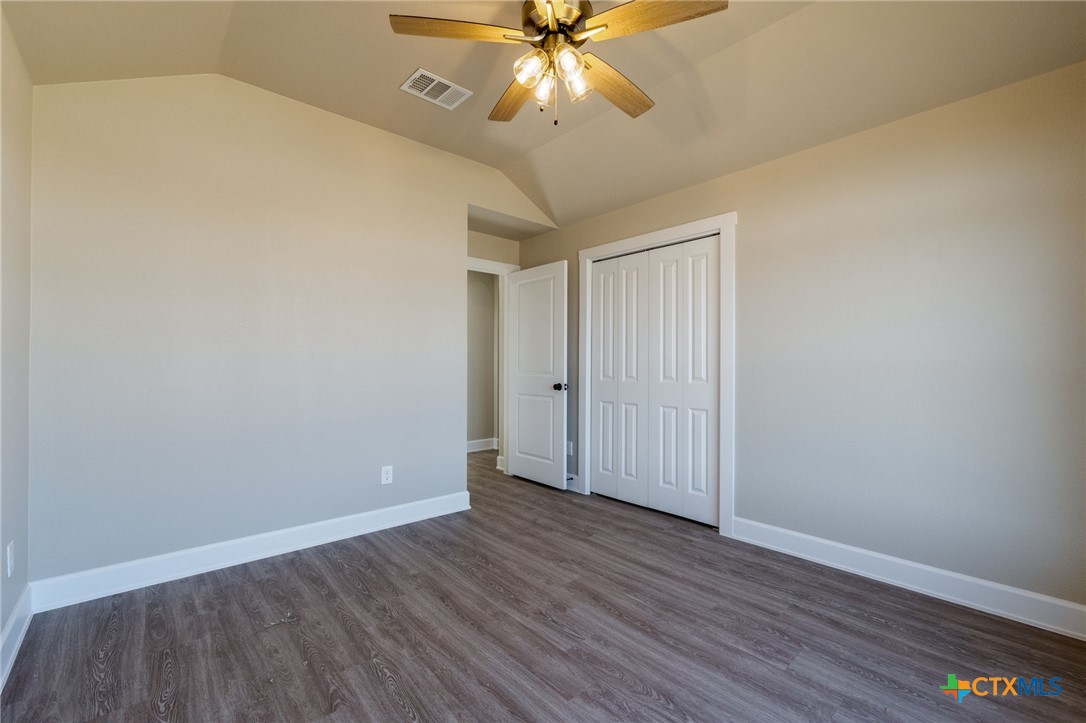 2005 Blackhawk Loop Belton, TX 76513 - Photo 28 of 37 a view of an empty room with window and wooden floor