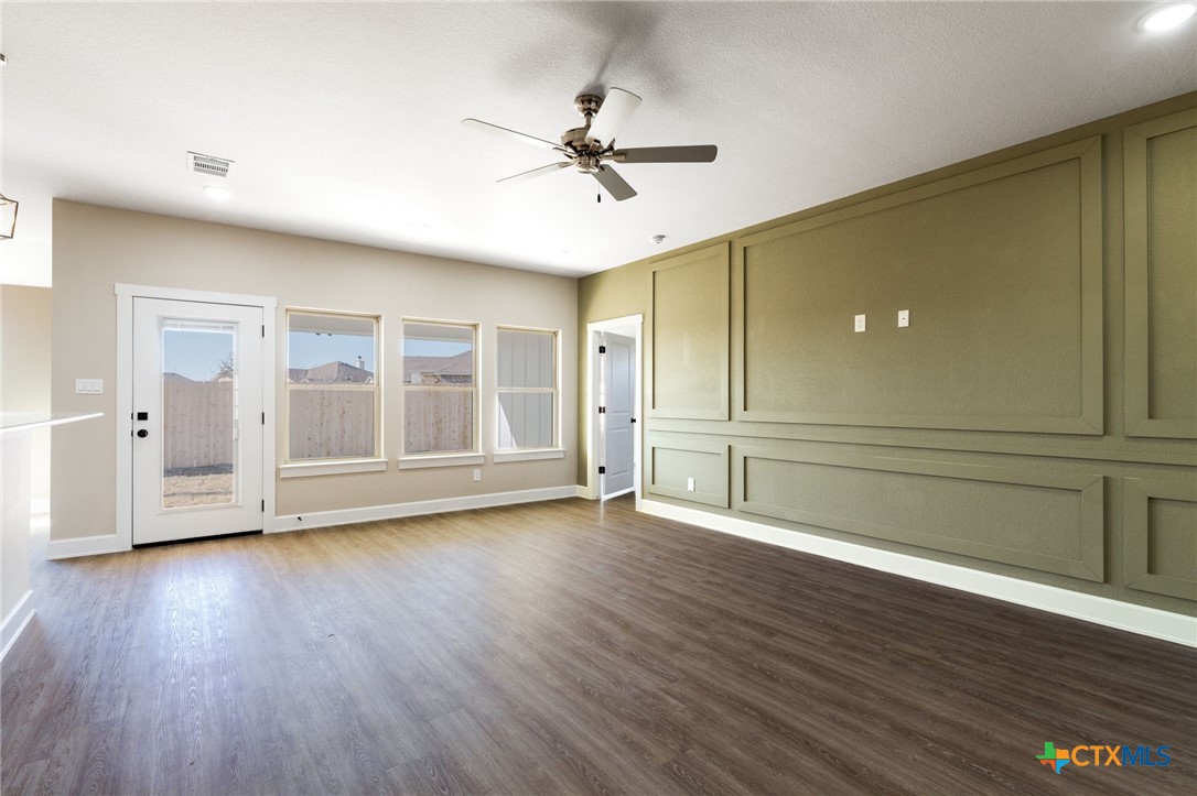 2005 Blackhawk Loop Belton, TX 76513 - Photo 6 of 37 a view of empty room with wooden floor and fan